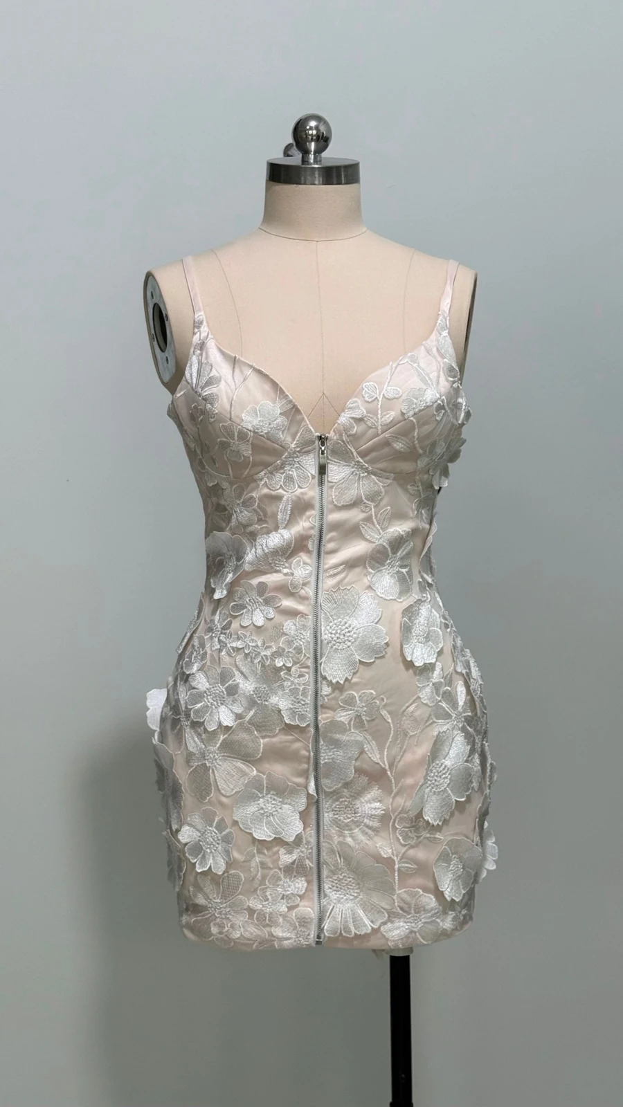 Real photo of apricot 3D floral spaghetti strap mini dress on a mannequin