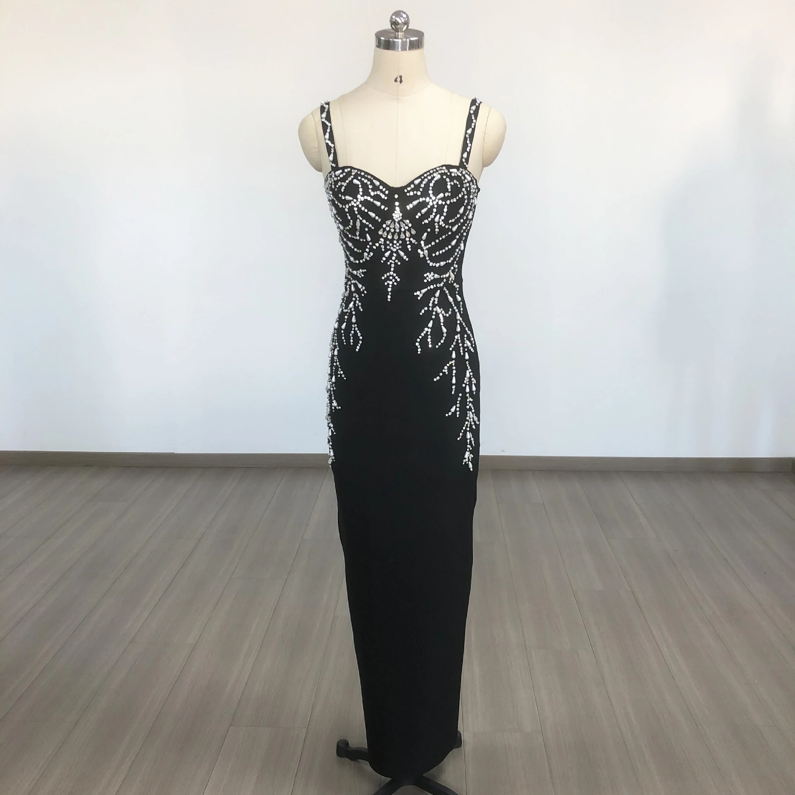 Real photo of black beaded spaghetti strap bandage maxi dress on a mannequin
