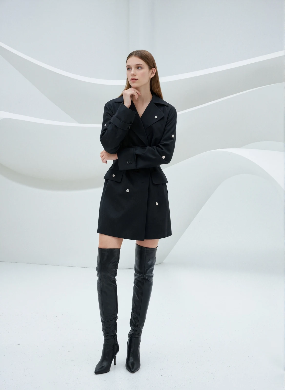Model wearing black crystal studded belted blazer dress, front view