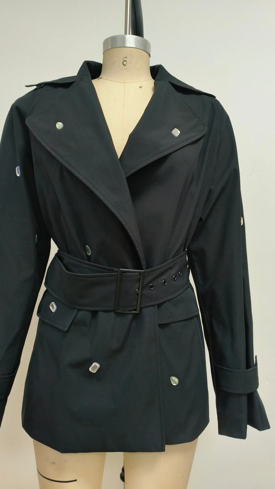 Real photo of black crystal studded belted blazer dress on a mannequin