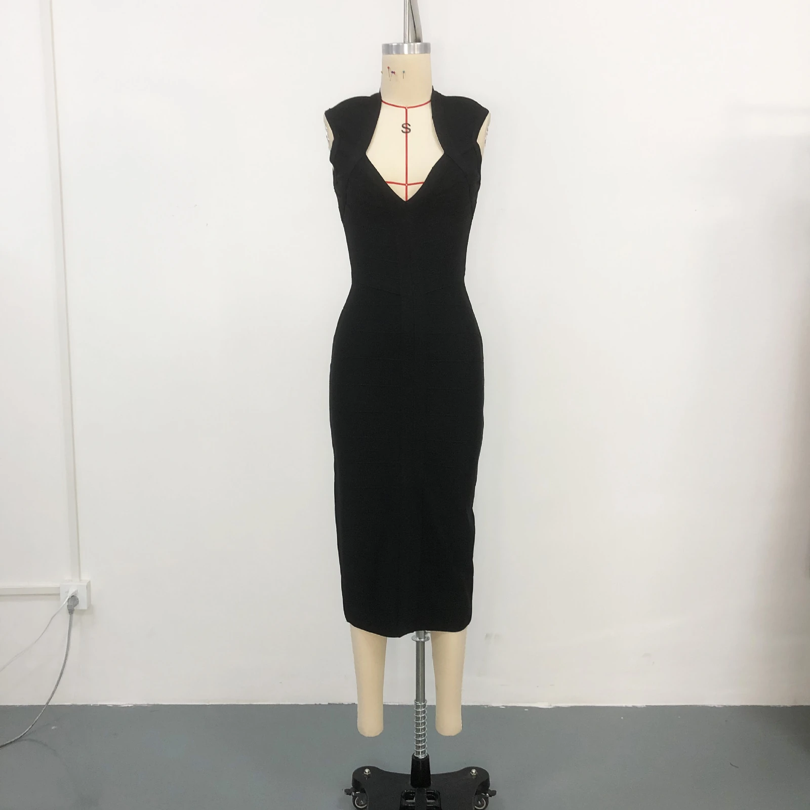 Real photo of black deep V neck sleeveless bandage midi dress on a mannequin