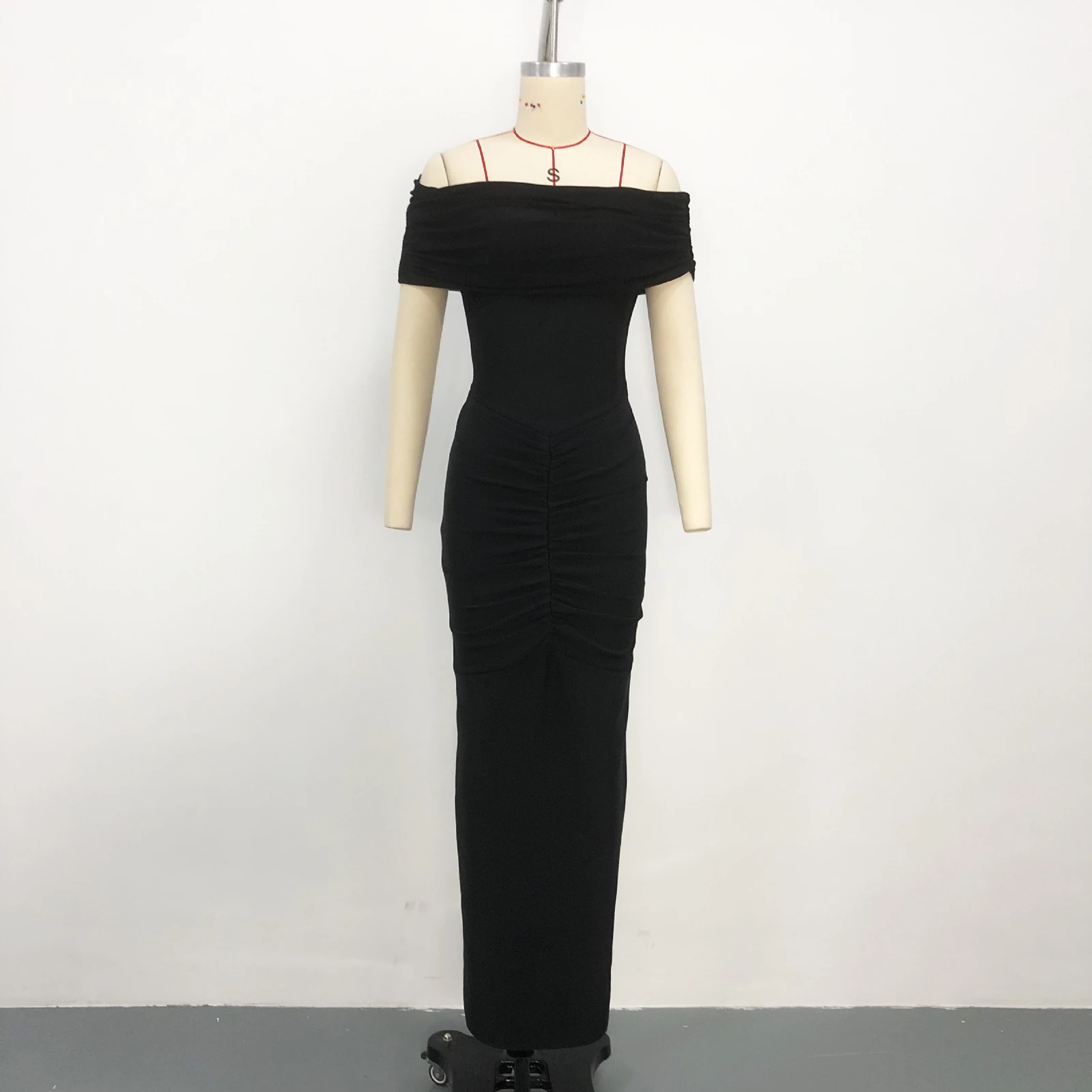 Real photo of black off shoulder top and strapless ruched bandage maxi dress set on a mannequin