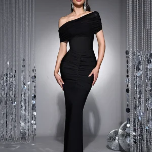Model wearing black two-piece set: off-shoulder ruched top over a strapless bodycon maxi dress, front view