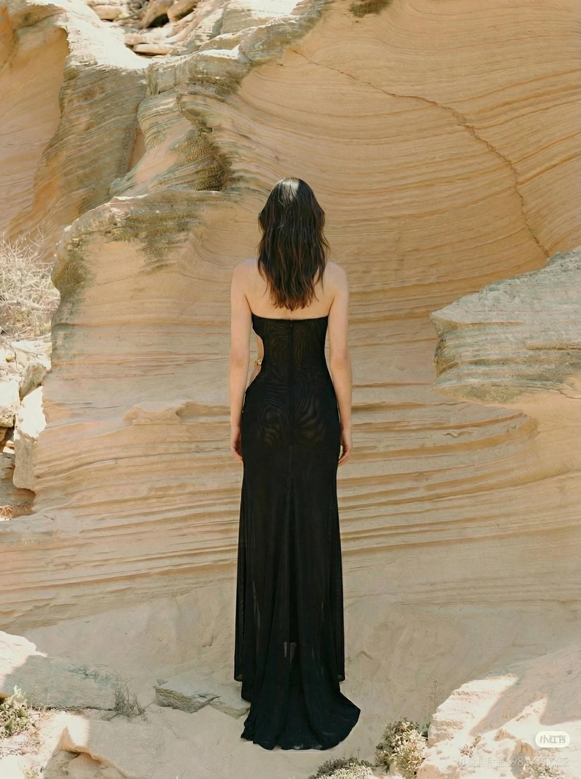 Back view of black one-shoulder maxi dress