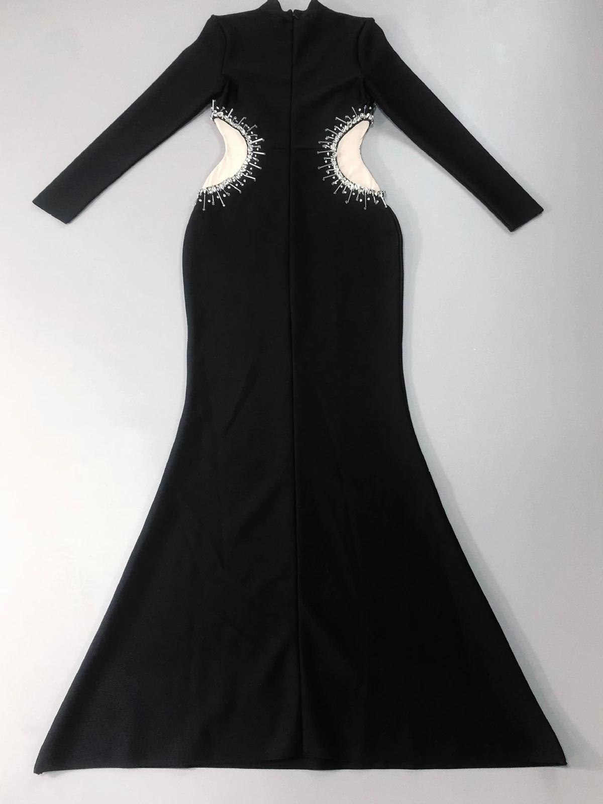 Flat lay of black long sleeve rhinestone mesh bandage mermaid maxi dress