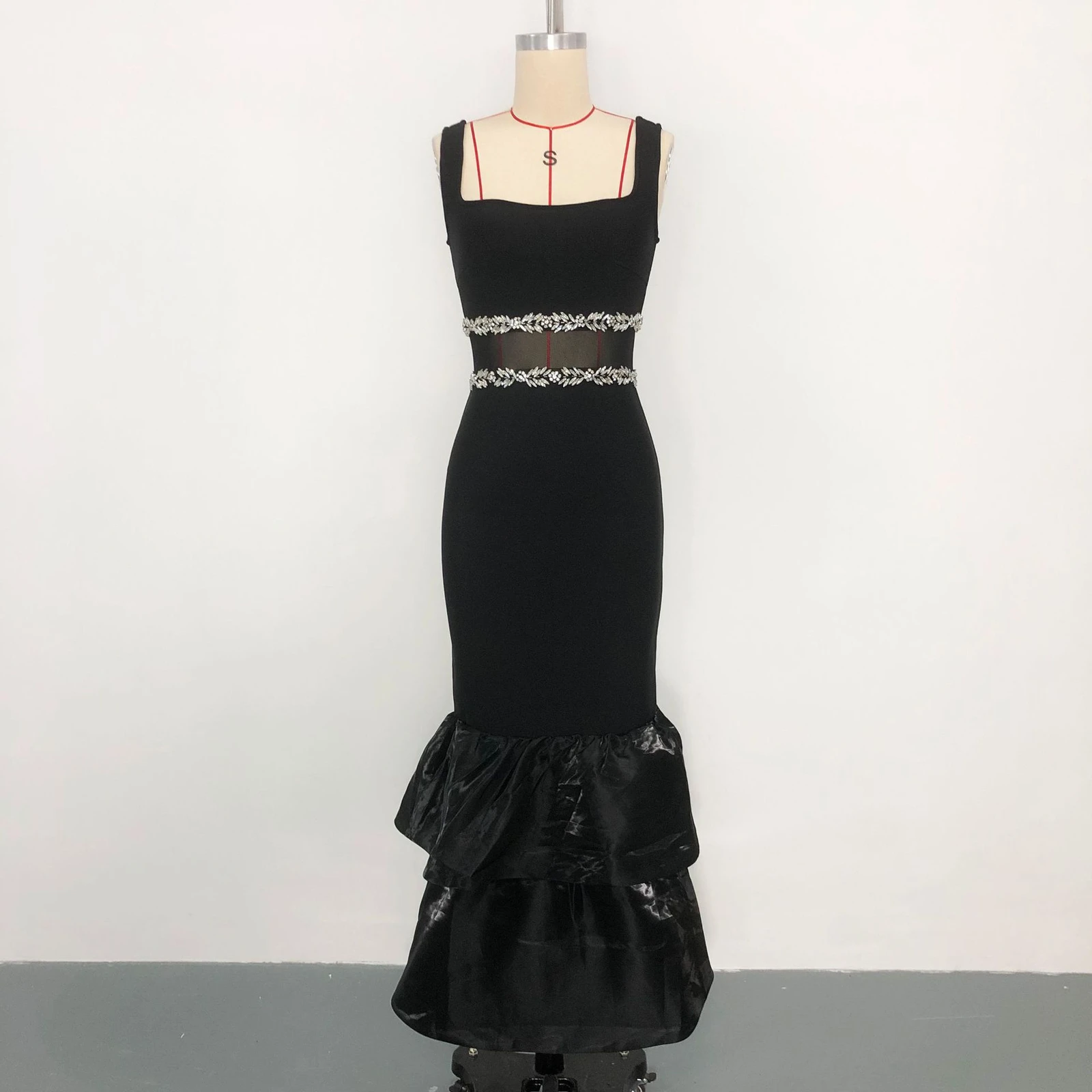 Real photo of black rhinestone mesh waist tiered ruffle bandage maxi dress on a mannequin