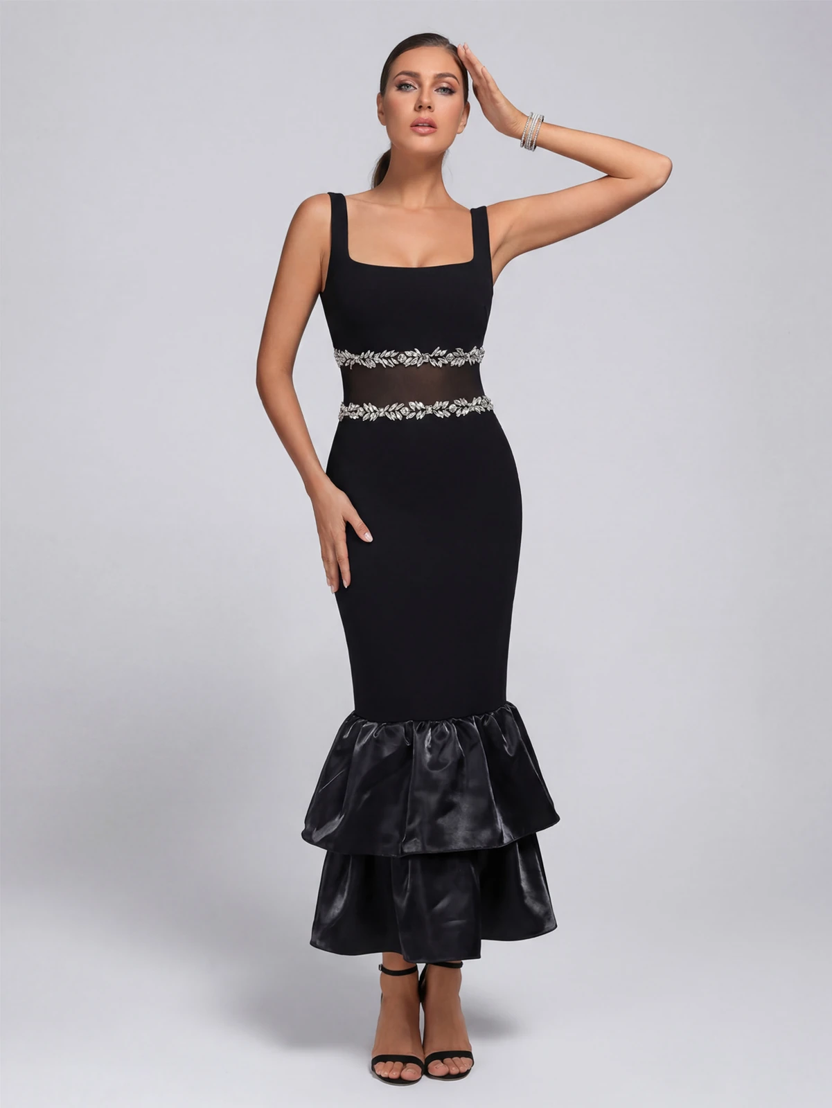 Full-length view of black square neck rhinestone bandage maxi dress with ruffled hem