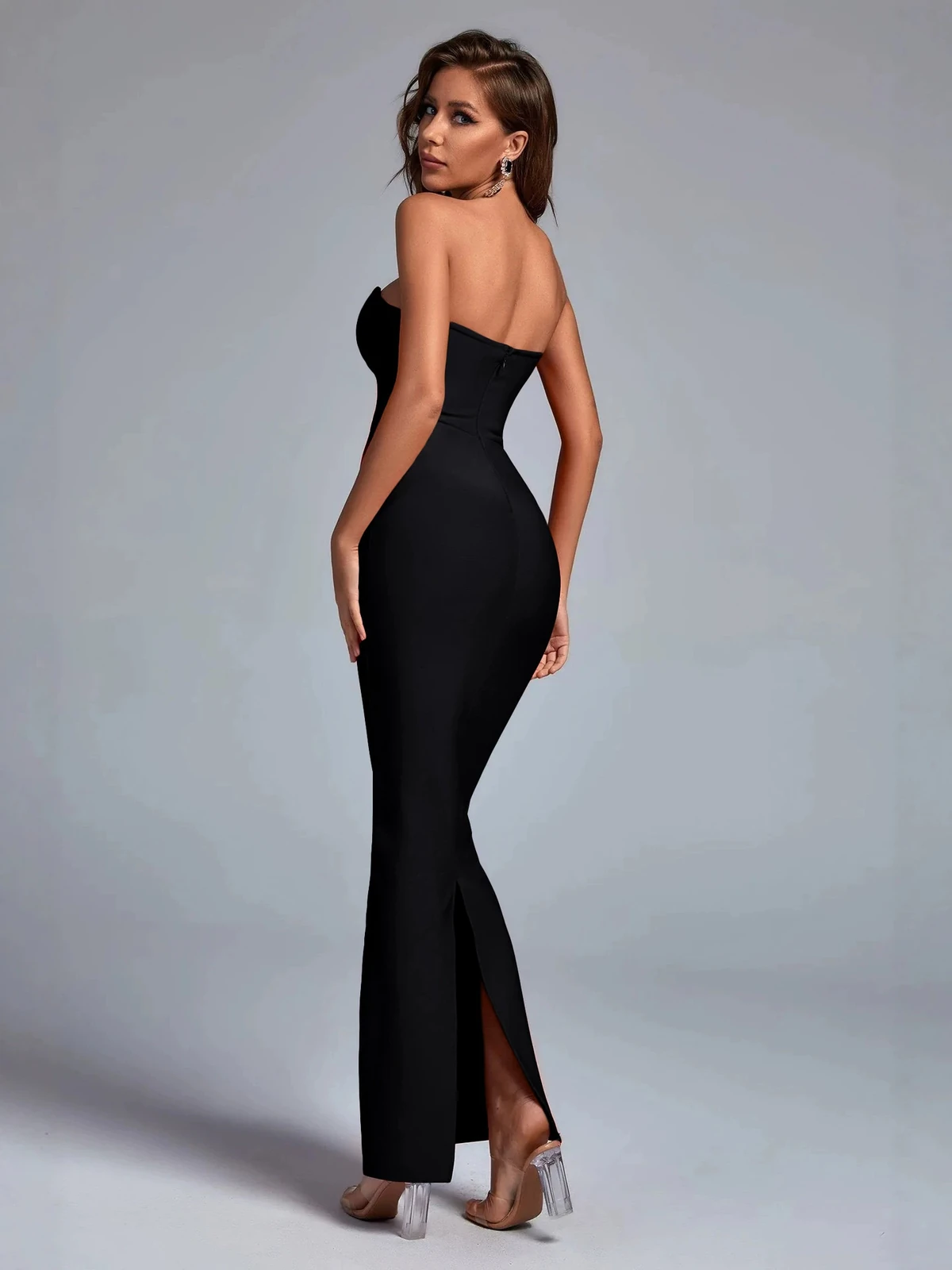 Back view of black strapless bandage maxi dress with back slit