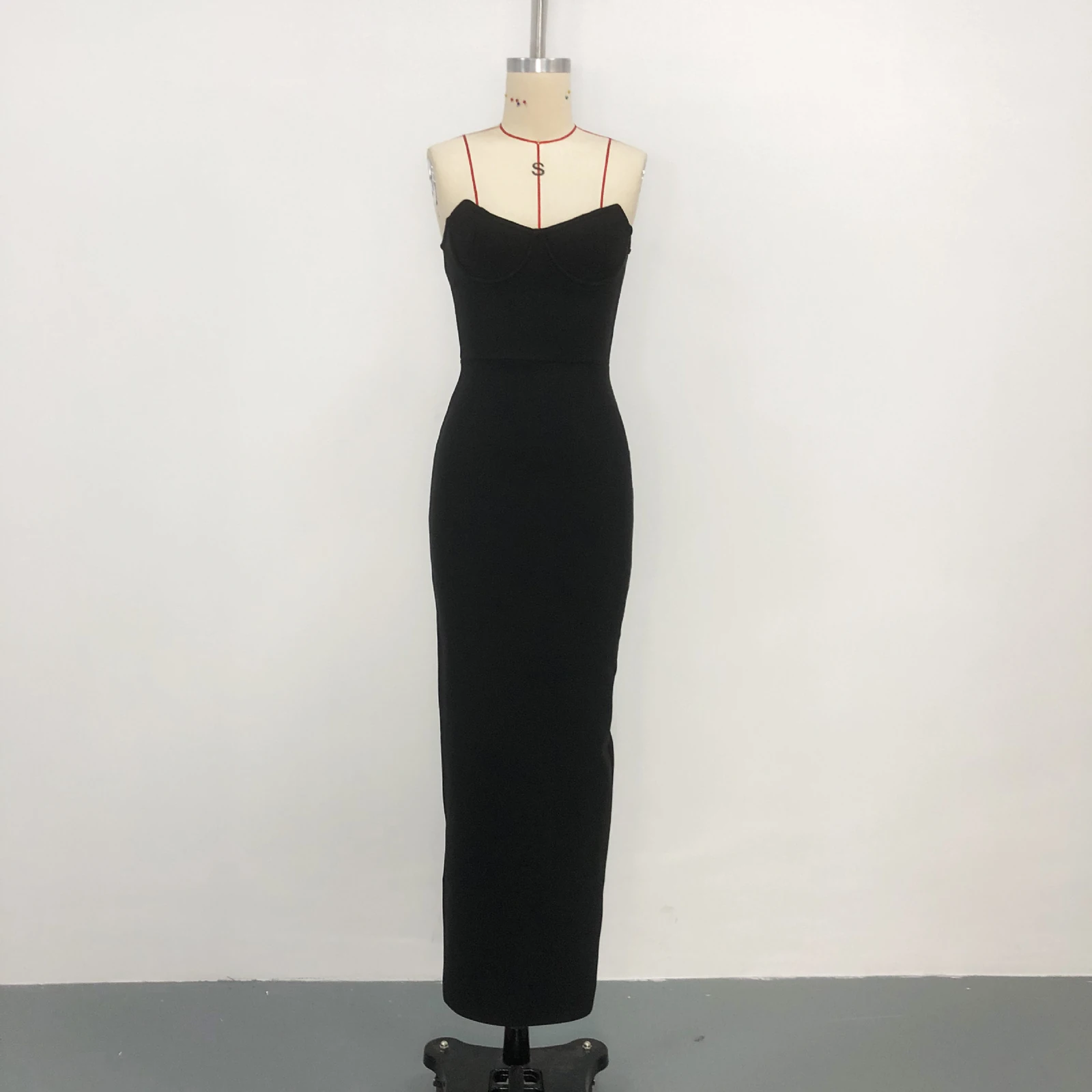 Real photo of black strapless sweetheart bandage maxi dress on a mannequin, front view
