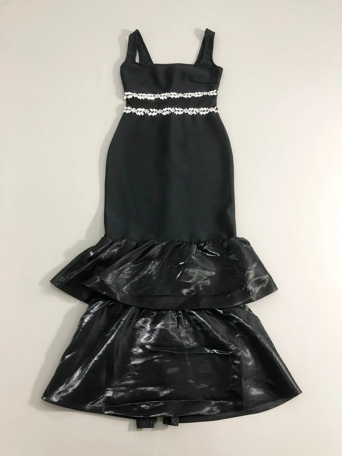 Flat lay of black rhinestone mesh waist tiered ruffle bandage maxi dress