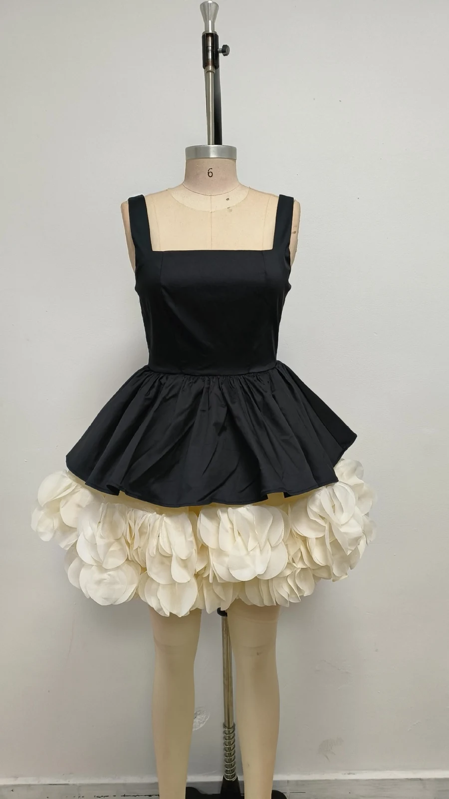 Real photo of black and white puffball mini dress on a mannequin