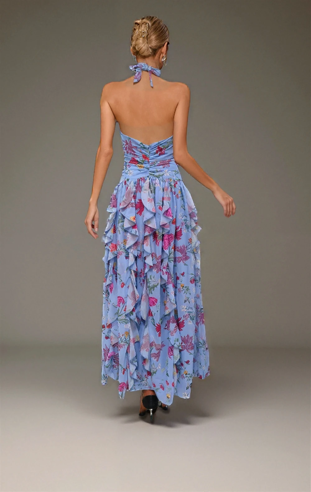 Back view of blue floral print halter ruffle maxi dress