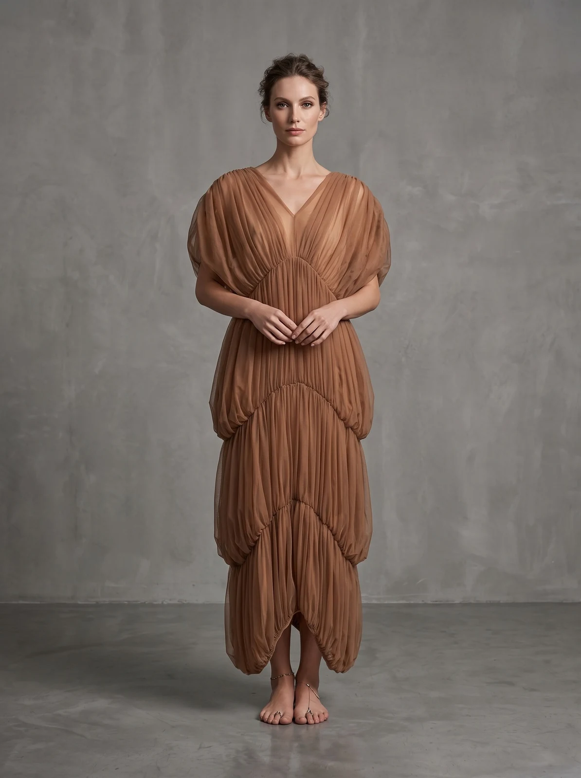 Model wearing brown deep V tiered ruched maxi dress, front view