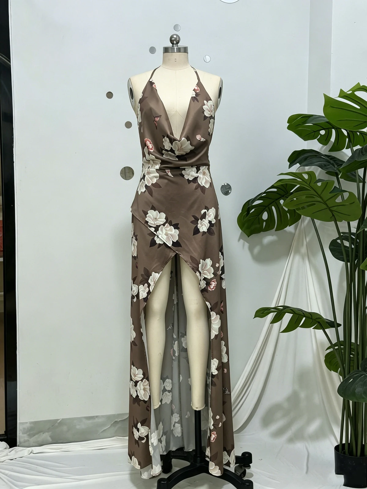 Real photo of brown floral satin cowl neck maxi dress on a mannequin