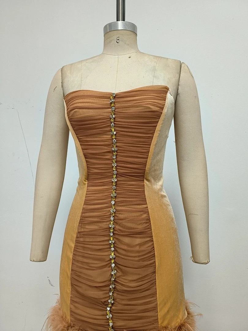Real photo of caramel brown ruched rhinestone mini dress on a mannequin