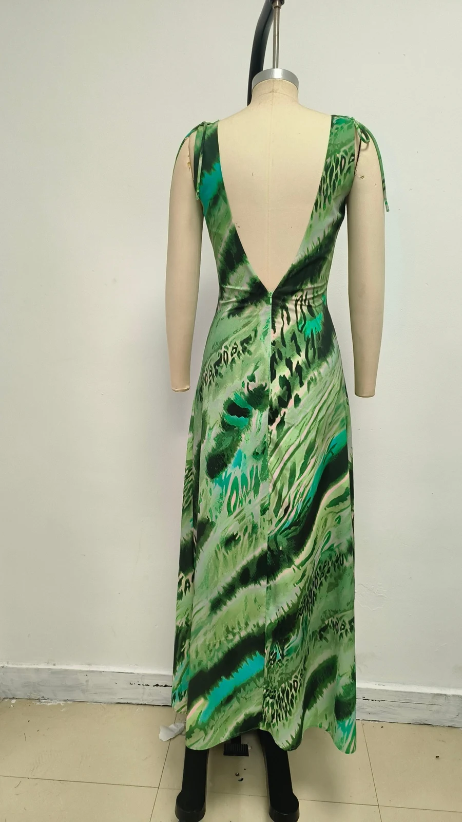 Real photo of green print maxi dress on a mannequin, back view