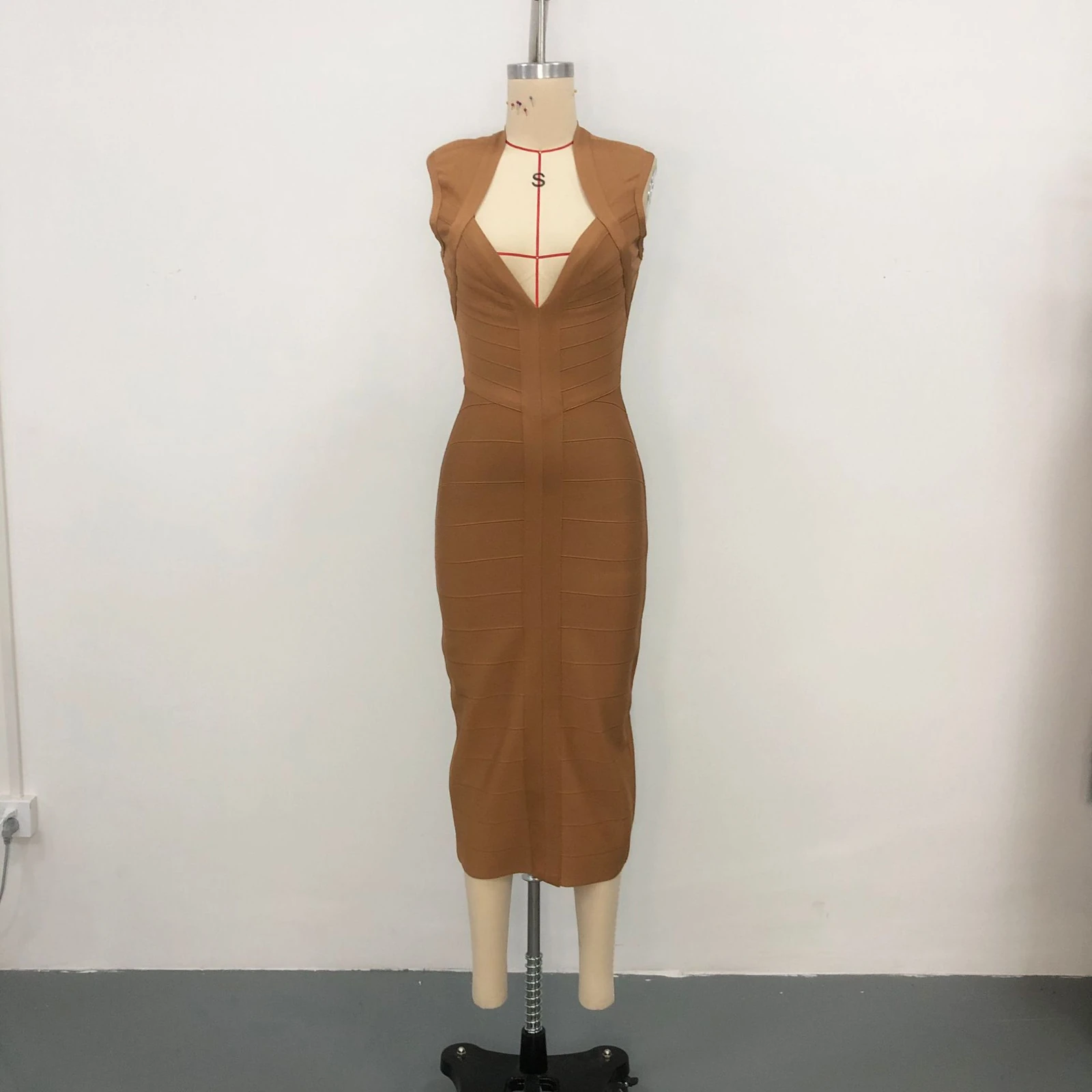 Real photo of khaki deep V neck sleeveless bandage midi dress on a mannequin