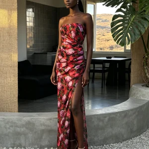 Model wearing multi strapless floral draped high slit maxi dress, front view