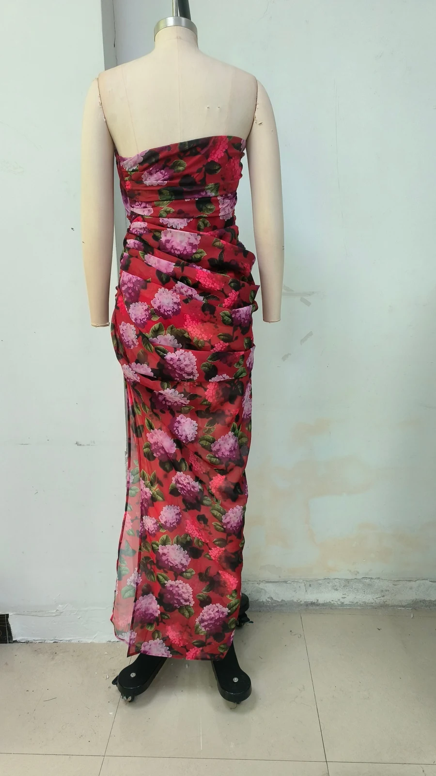 Real photo of multi strapless floral draped high slit maxi dress, back view