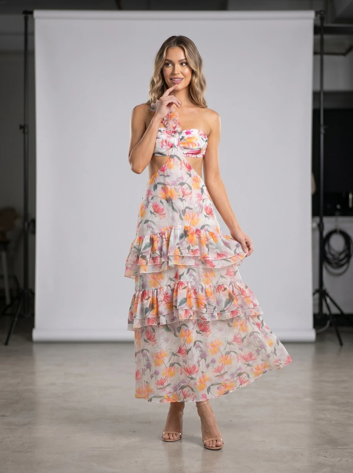 Model wearing multicolour floral print one-shoulder tiered ruffle maxi dress, front view