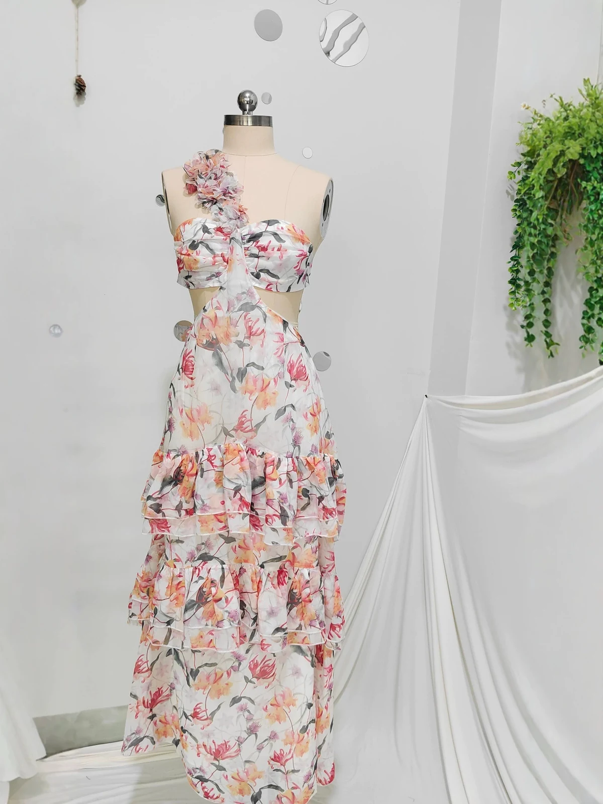Real photo of multicolour floral one-shoulder maxi dress on a mannequin