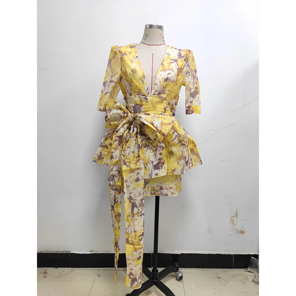 Real photo of multi floral print puff sleeve ruffle mini dress on a mannequin