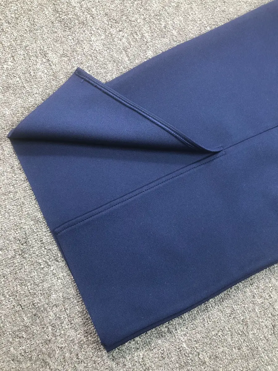 Close-up of the navy bandage fabric and hem detail on the two piece set