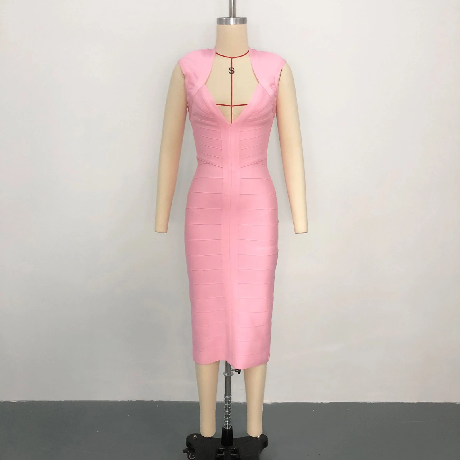 Real photo of pink deep V neck sleeveless bandage midi dress on a mannequin