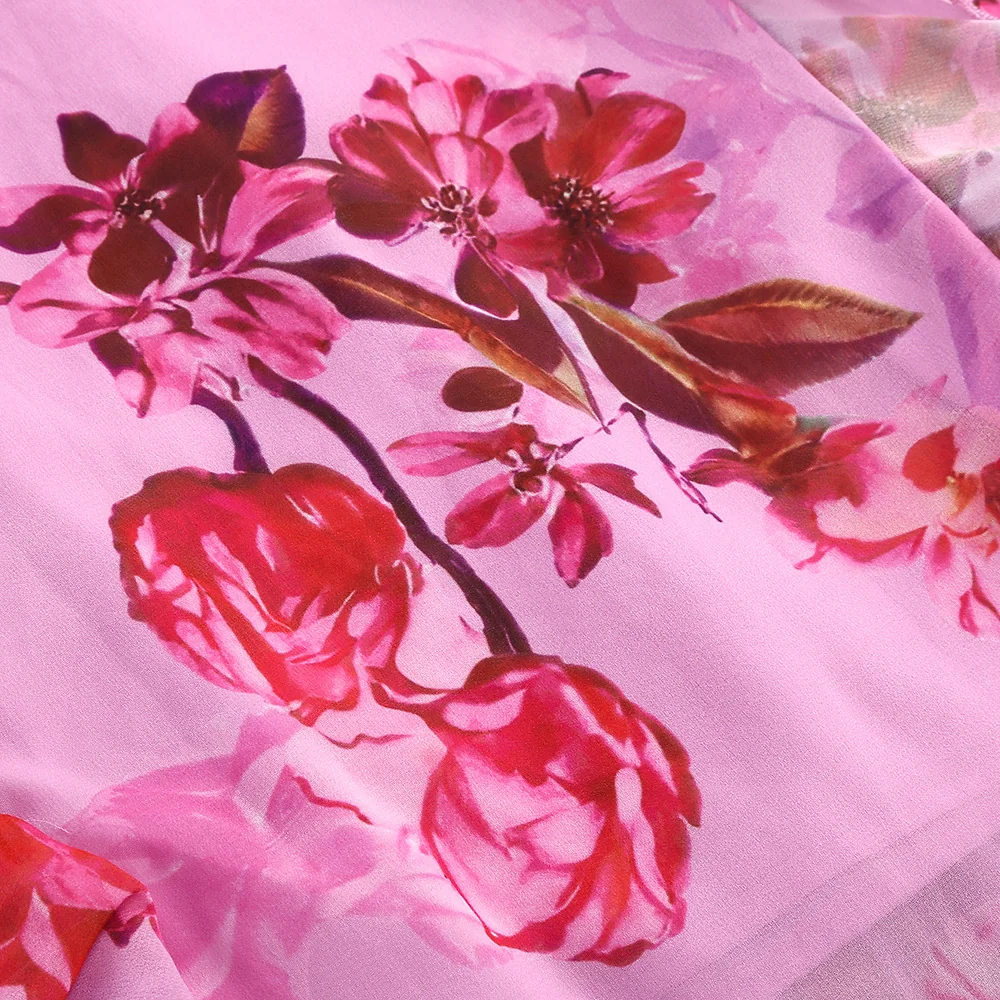 Close-up of the floral print on pink chiffon-look fabric