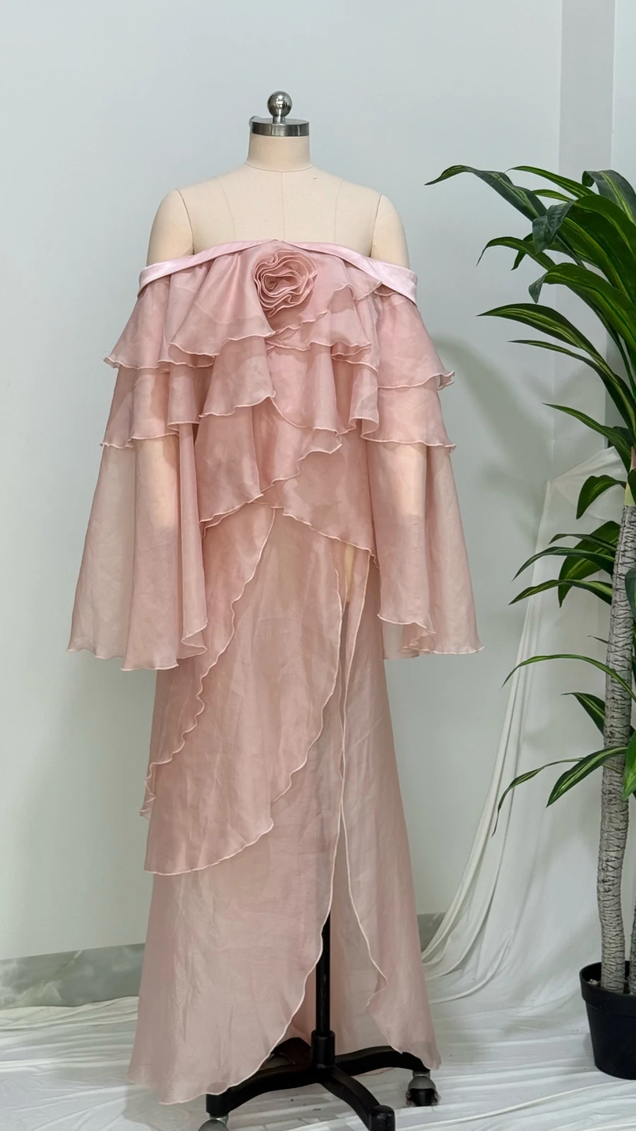 Real photo of pink off-shoulder tiered ruffle chiffon maxi dress on a mannequin