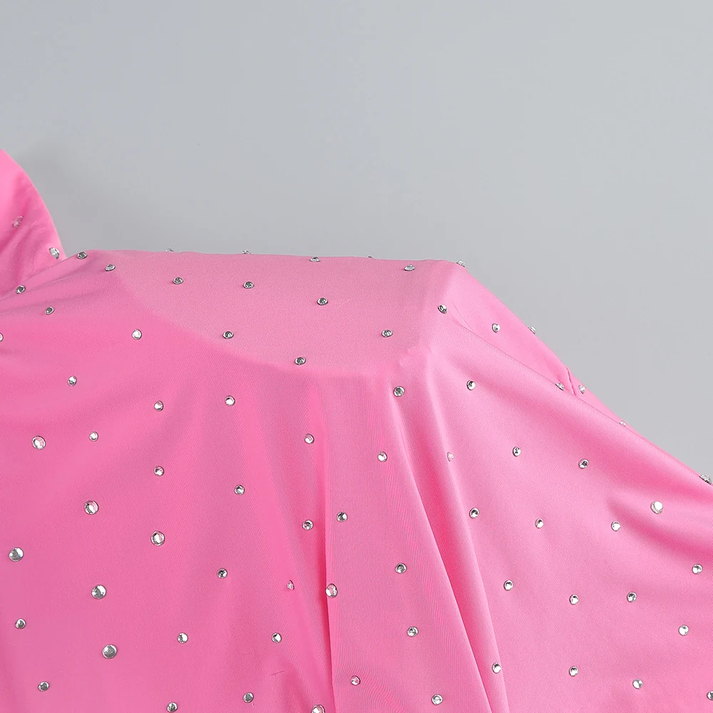 Close-up of hot-fix rhinestones on pink dress shoulder