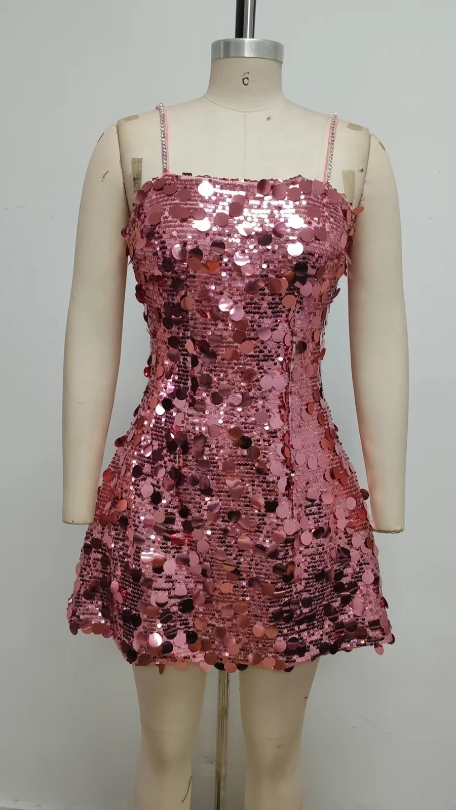 Real photo of pink sequin mini dress on a mannequin