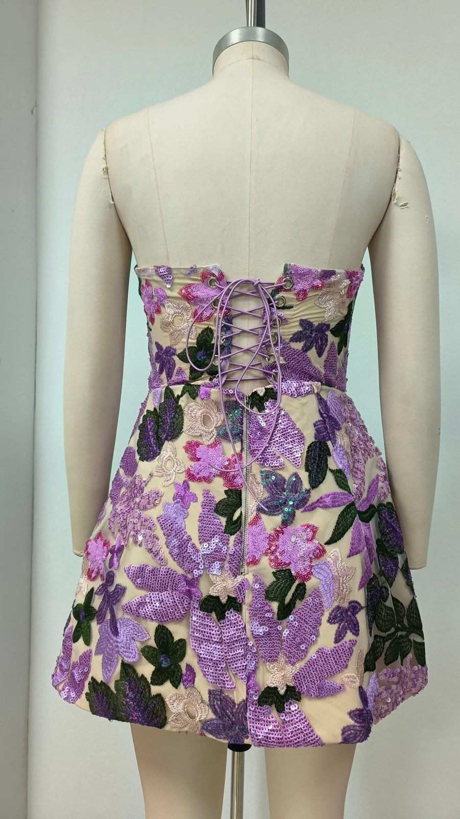 Real photo of purple strapless sequin floral A-line mini dress, back view