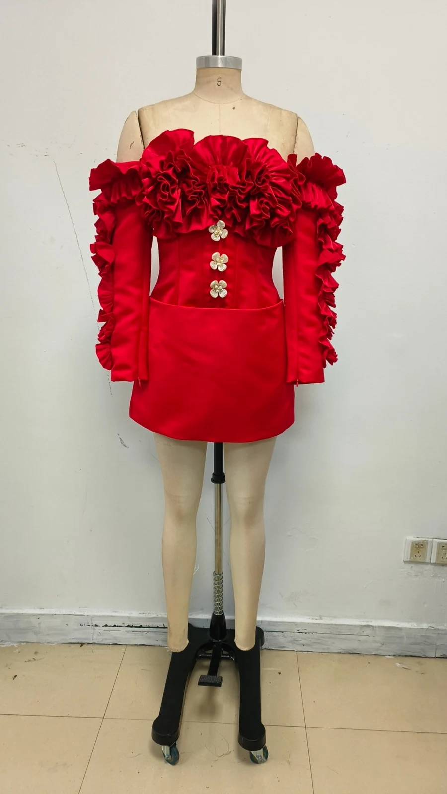 Real photo of red off-shoulder ruffle mini dress on a mannequin