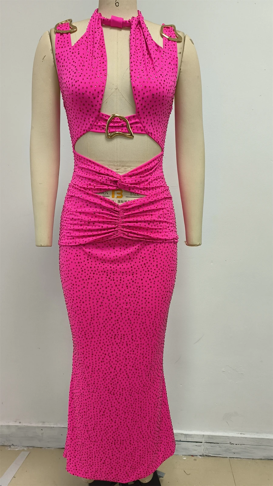 Real photo of rose red halter cut out maxi dress on a mannequin