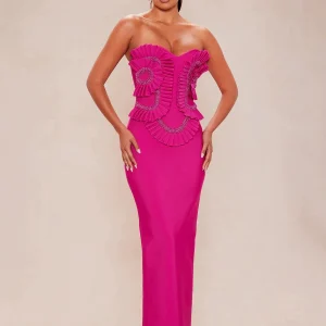 Model wearing rose red strapless bandage maxi dress with ruffle and beaded bodice, front view