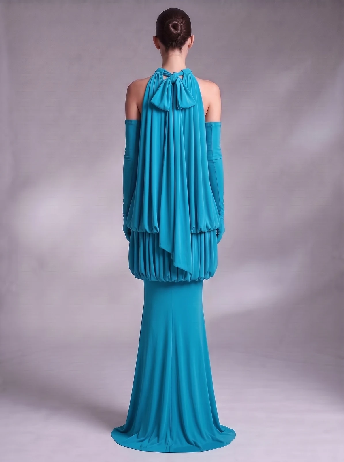 Back view of turquoise halter blouson mermaid maxi dress