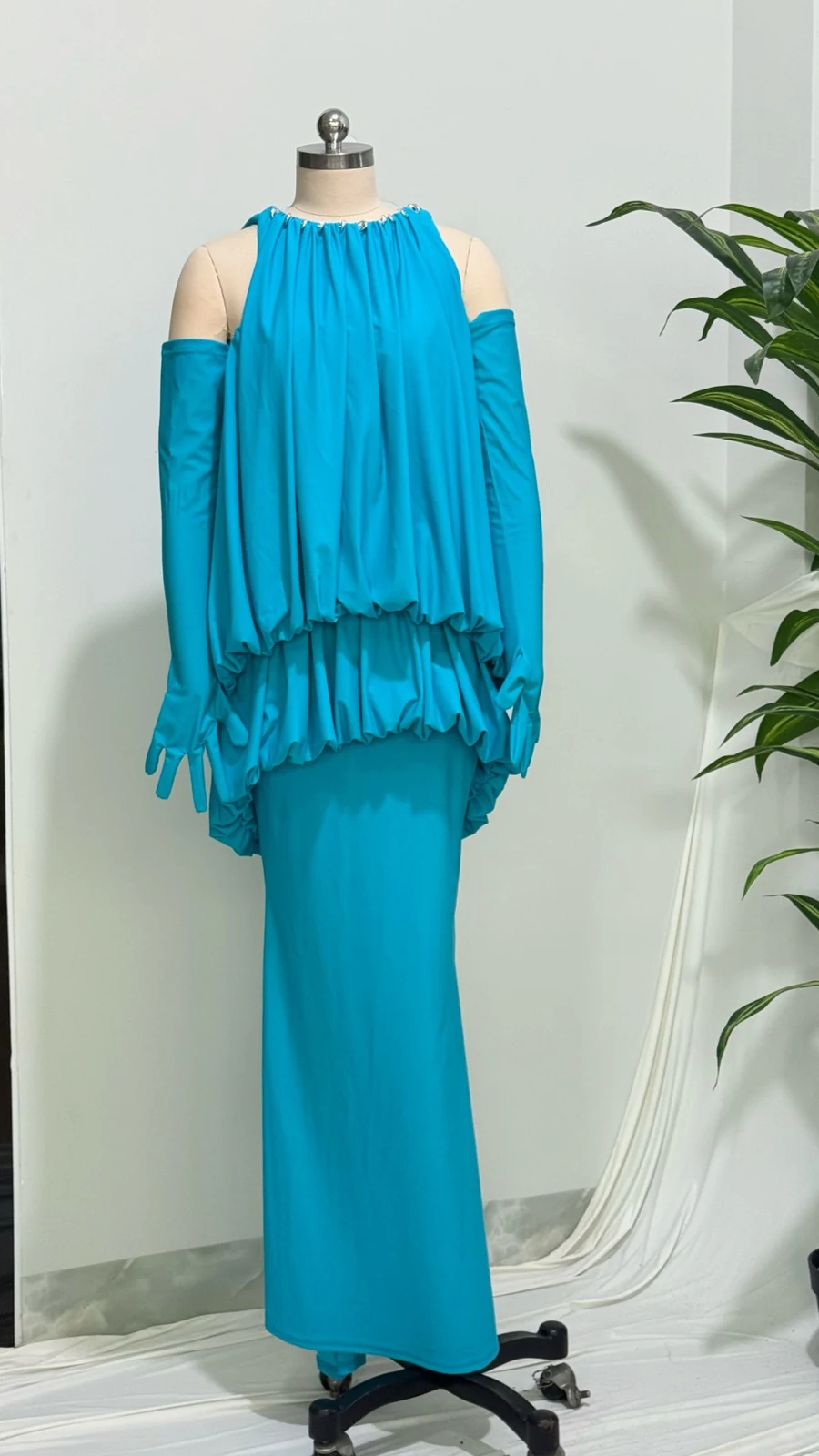 Real photo of turquoise halter blouson maxi dress on a mannequin