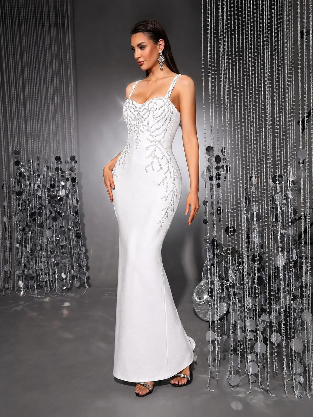 Side view of white beaded spaghetti strap bodycon bandage maxi dress