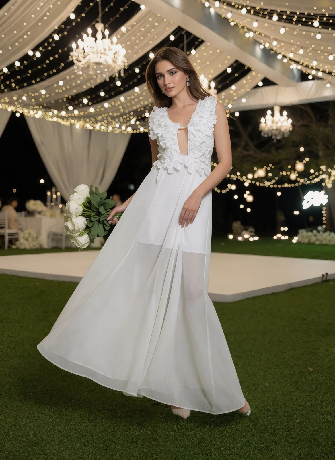 Model in white deep V ruffle maxi dress at a garden party