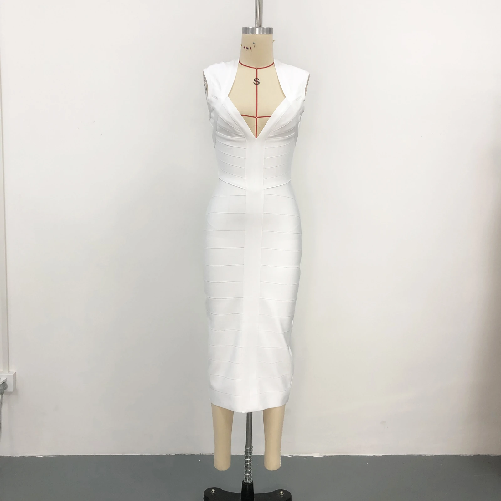Real photo of white deep V neck sleeveless bandage midi dress on a mannequin