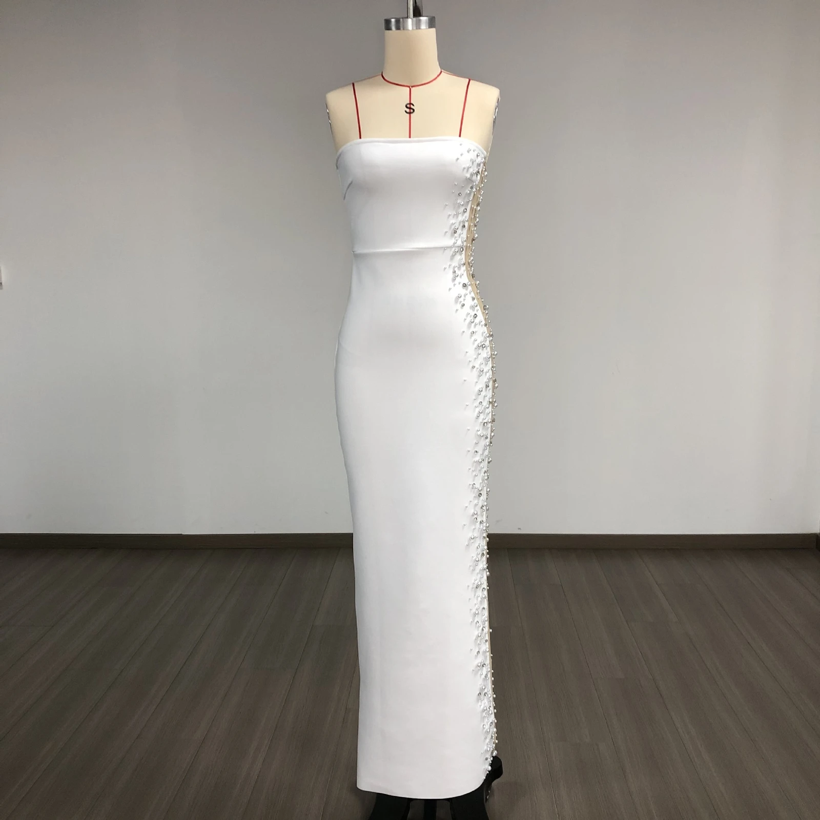 Real photo of white pearl beaded mesh strapless bandage maxi dress on a mannequin