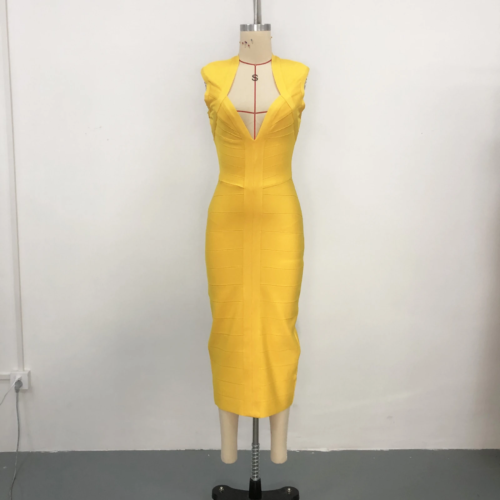 Real photo of yellow deep V neck sleeveless bandage midi dress on a mannequin