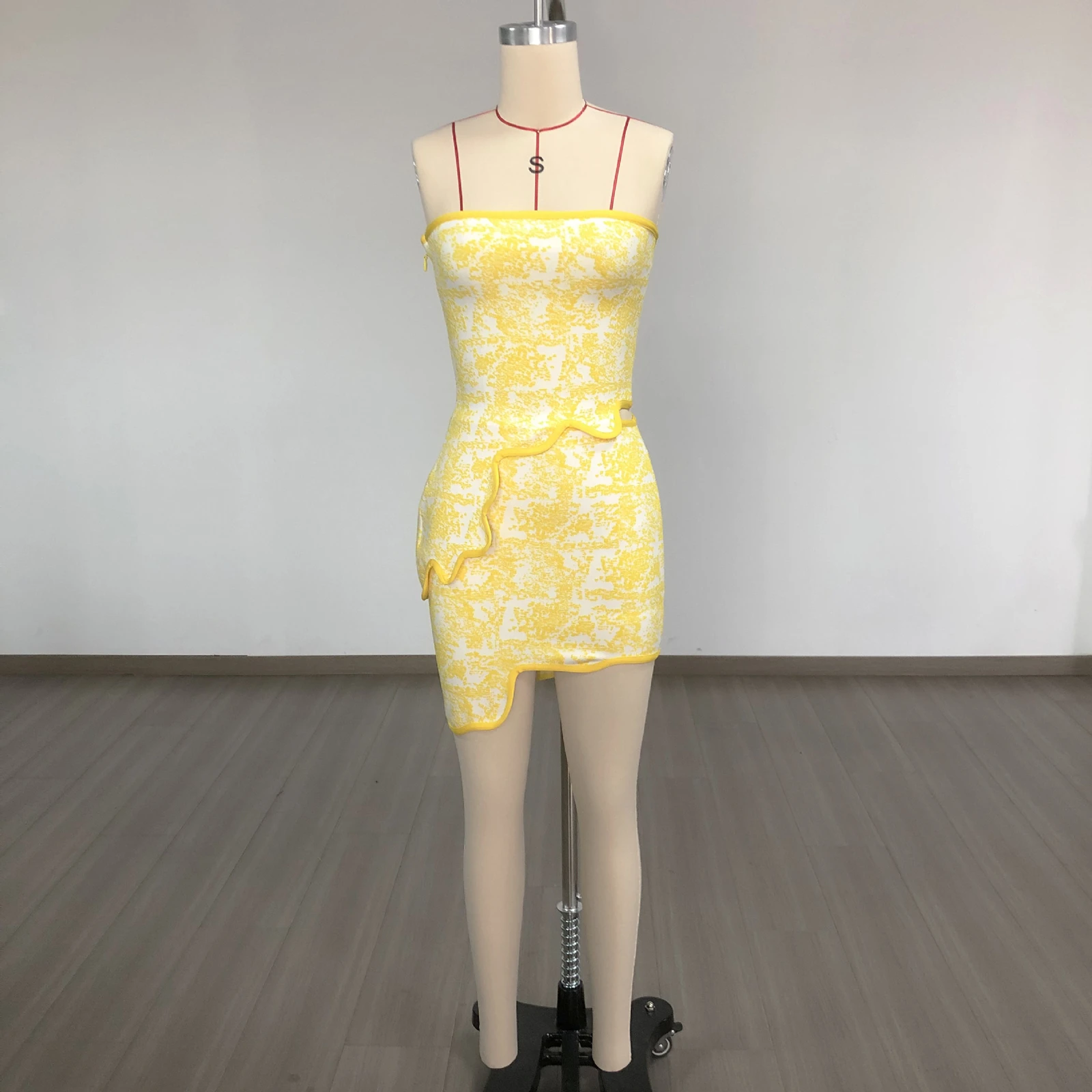 Real photo of yellow jacquard strapless bandage crop top and skirt set on a mannequin