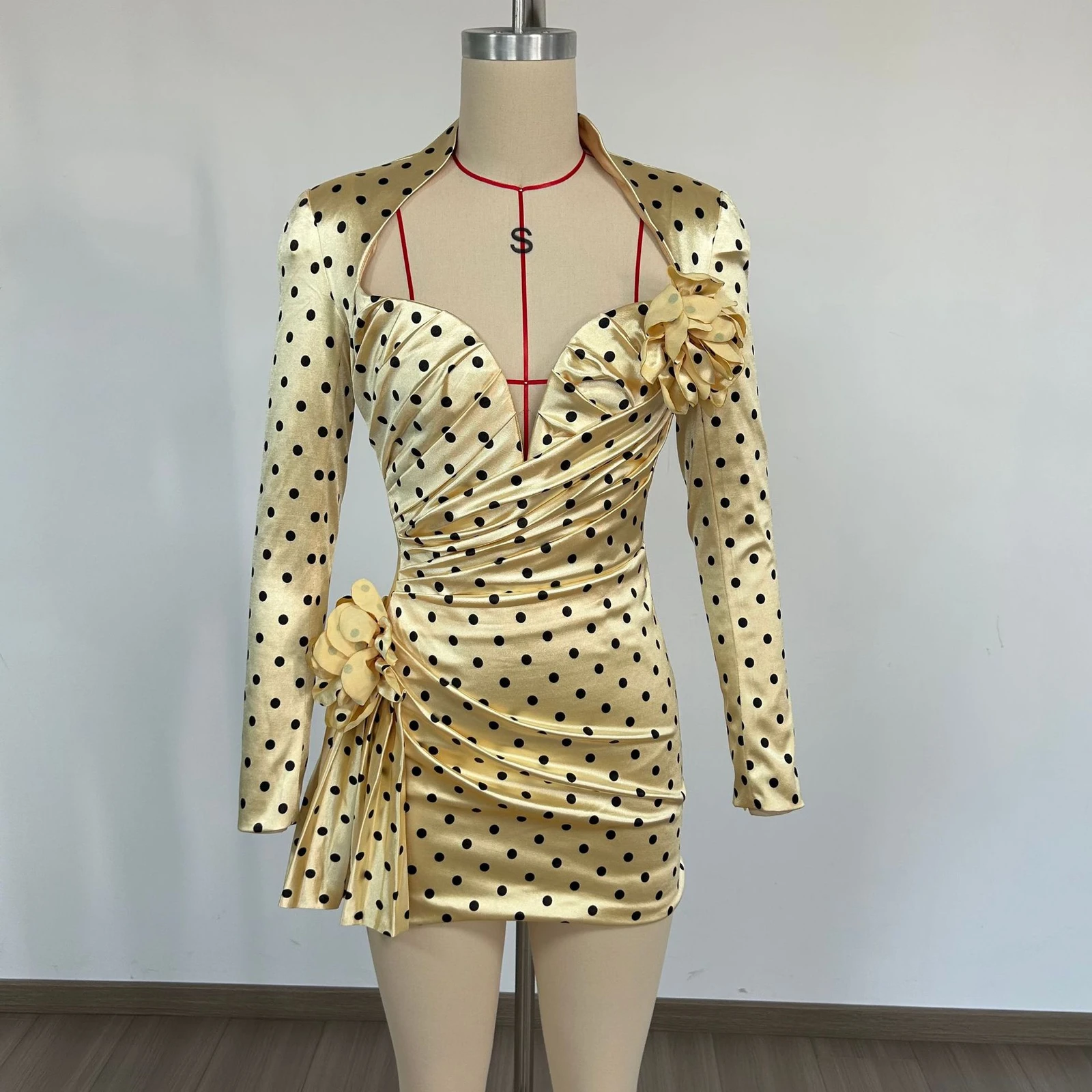 Real photo of yellow polka dot deep V long sleeve ruched mini dress on a mannequin